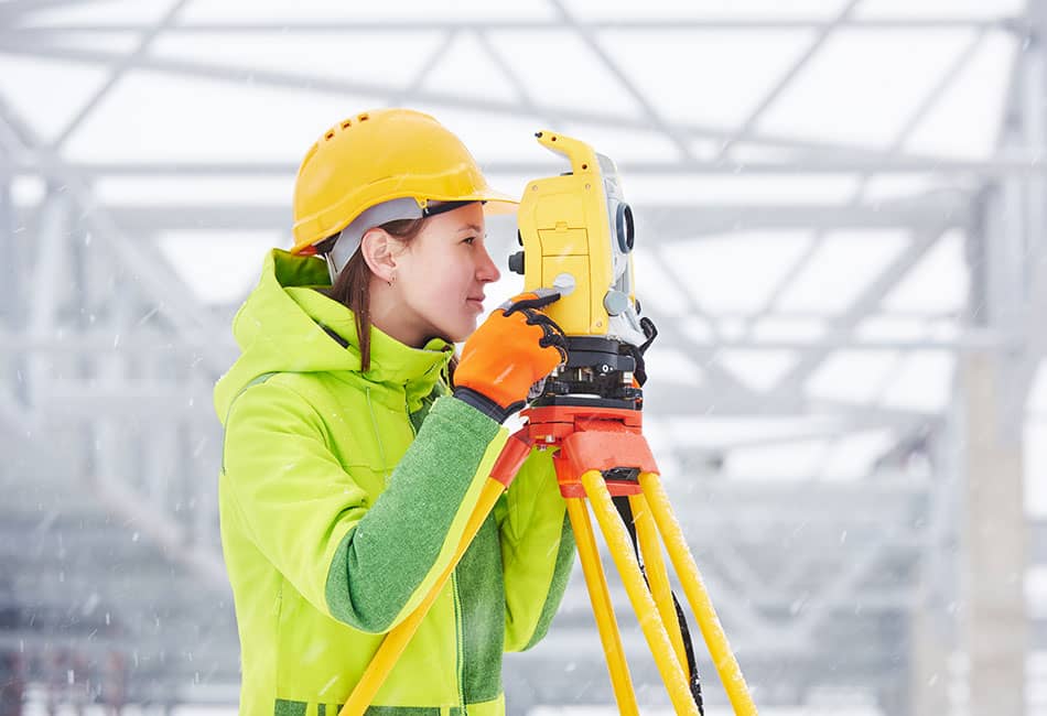 Surveyor on site with a total station